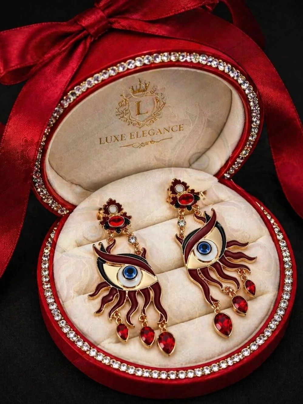 Gold-Tone Red Eye Drop Earrings with Blue Center